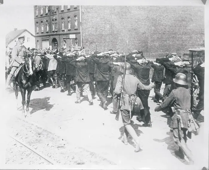 Framed Print : Citizens With Hands on Their Heads Being Escorted by Police