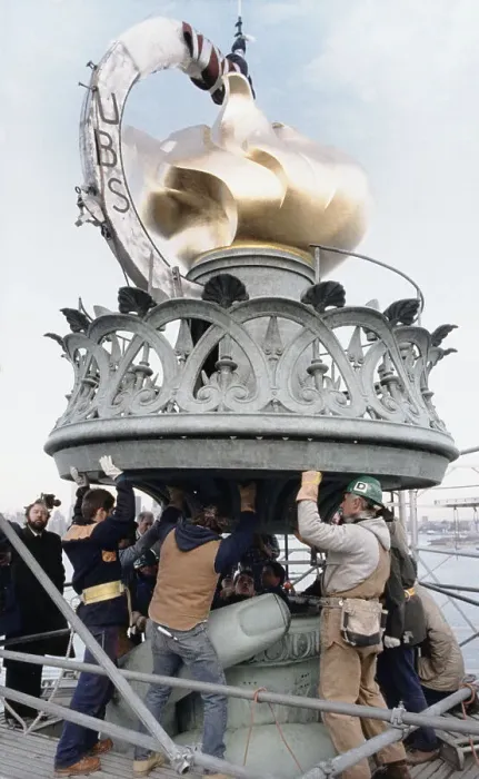 Framed Print : City Workers Mounting the Statue of Liberty Torch