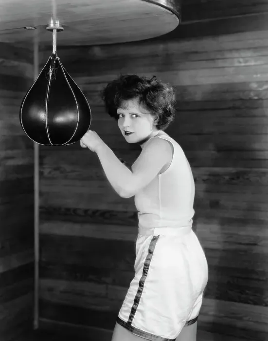 Framed Print : Clara Bow Posing with Punching Bag in Gym Shorts Framed Print : Clara Bow Posing with Punching Bag in Gym Shorts