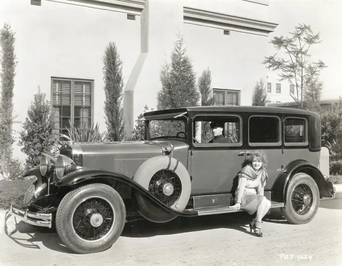 Framed Print : Clara Bow Sitting on Automobile Running Board Framed Print : Clara Bow Sitting on Automobile Running Board