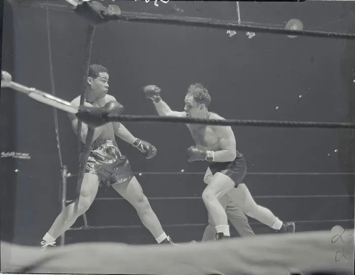 Framed Print : Clarence Burman Attacking Joe Louis Framed Print : Clarence Burman Attacking Joe Louis