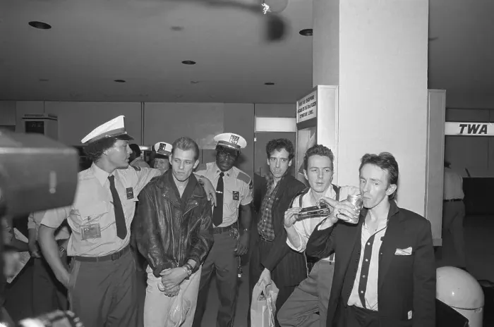 Framed Print : The Clash Standing With Airport Personnel Framed Print : The Clash Standing With Airport Personnel