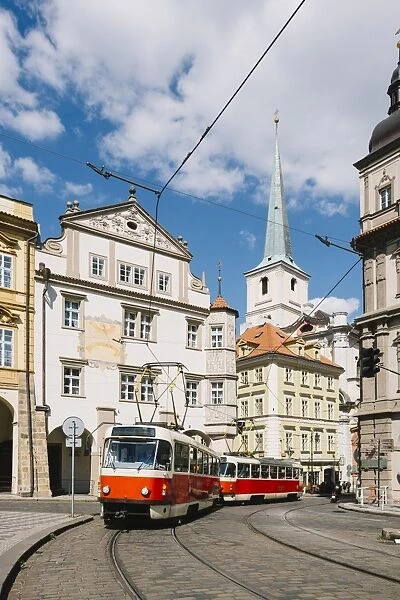 Classic red tram on the streets of Lesser own (Mala Strana) in Prague, Czech Republic
