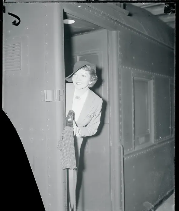 Framed Print : Claudette Colbert Peaking at the Camera From a Door Framed Print : Claudette Colbert Peaking at the Camera From a Door