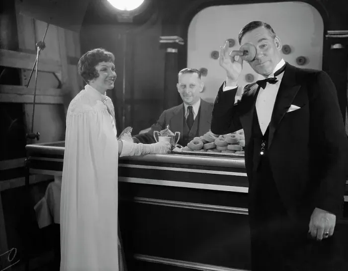Framed Print : Claudette Colbert and Walter Huston Having Doughnuts Framed Print : Claudette Colbert and Walter Huston Having Doughnuts