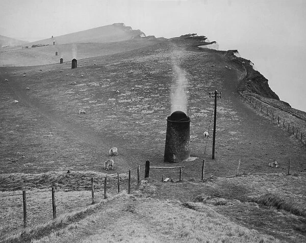 Cliff Tunnel. A line of smoke stacks along the top of Shakespeare Cliff between Dover