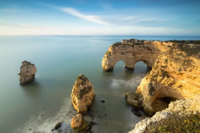 Framed Print : Cliffs framed by turquoise water Praia da Marinha Portugal