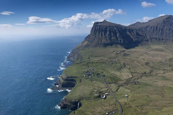 Cliffs and a small village, Gasadalur, Vagar, Faroe Islands, Denmark