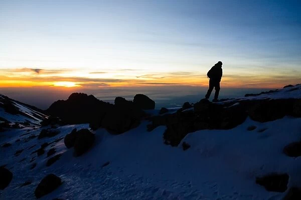 Climber Summiting Mt. Kilimanjaro