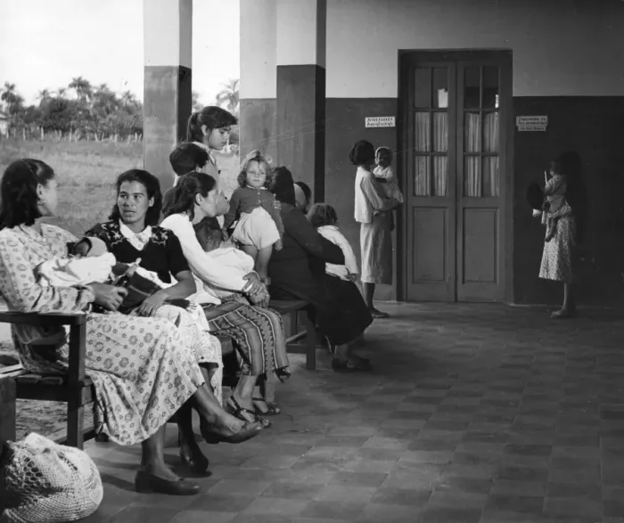 Framed Print : Clinic. circa 1930: Mothers in Paraguay wait with their children for a Framed Print : Clinic. circa 1930: Mothers in Paraguay wait with their children for a