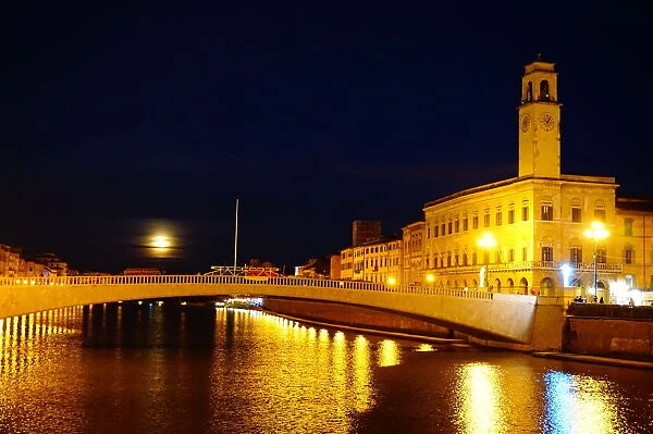 Clock tower and Arno River by night, Pisa, Italy