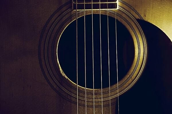 Close up of acoustic six string guitar