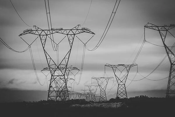 Close up image of overhead power lines sending electricity country wide