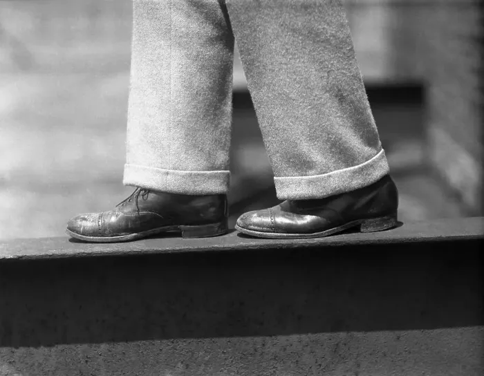Framed Print : Close up of mens legs on ledge Framed Print : Close up of mens legs on ledge
