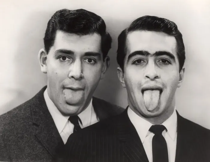 Framed Print : Close-up of two men with protruding tongues Framed Print : Close-up of two men with protruding tongues