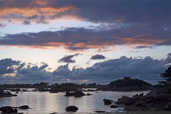 Cloud formations at sunset over the rocky bay of Sain-Guirec, Ploumanac h, Cote de Granit Rose, Brittany, France, Europe