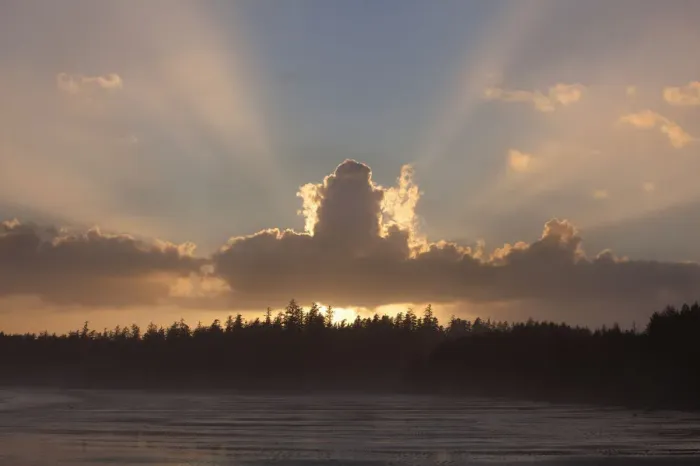 Framed Print : Clouds Are Backlit By The Sun At Sunset At Incinerator Rock Area Of Long Beach In Pacific Rim National Park Near Tofino; British Columbia Canada