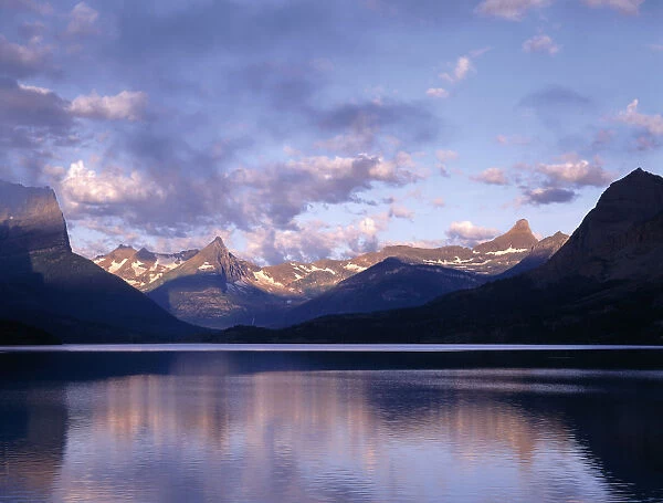 Clouds over lake surrounded by rocky mountains, Saint Mary Lake, Glacier National Park, Montana, USA