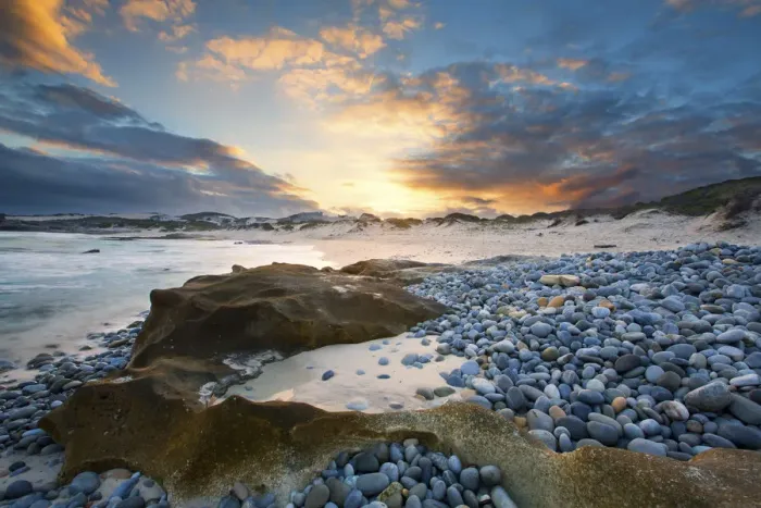 Framed Print : Clouds at sunset over a sand and pebble beach - Arniston South Africa Framed Print : Clouds at sunset over a sand and pebble beach - Arniston South Africa