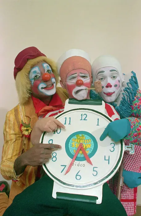 Framed Print : Clowns Holding a Clock Framed Print : Clowns Holding a Clock