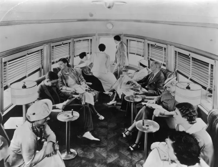 Framed Print : Club Car. A group of passengers lounge in a trains cone-shaped club car Framed Print : Club Car. A group of passengers lounge in a trains cone-shaped club car