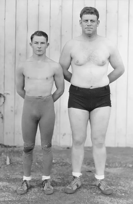Framed Print : Clyde Moore Standing Next to Warren McDouglas
