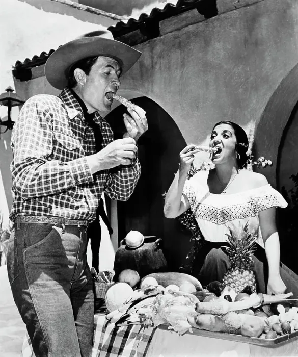 Framed Print : Smoky. Co-stars Fess Parker and Katy Jurado eating on the set of the western film Smoky Framed Print : Smoky. Co-stars Fess Parker and Katy Jurado eating on the set of the western film Smoky