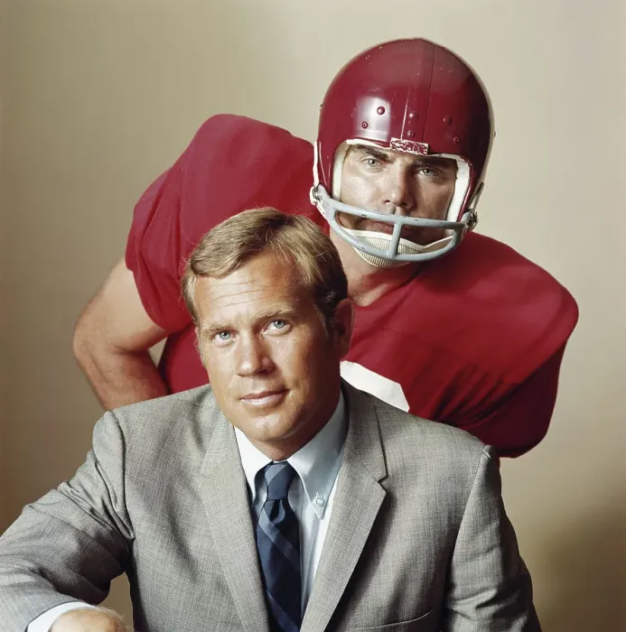 Framed Print : Coach with American football player, portrait Framed Print : Coach with American football player, portrait
