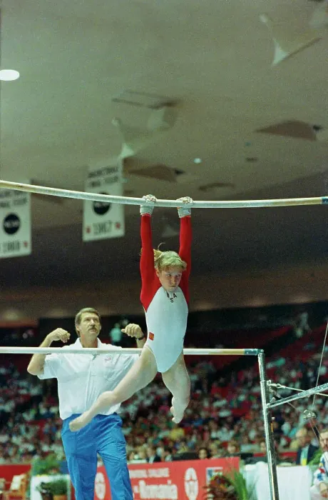 Framed Print : Coach Bela Karolyi Instructing Kim Zmeskal on Bars Framed Print : Coach Bela Karolyi Instructing Kim Zmeskal on Bars