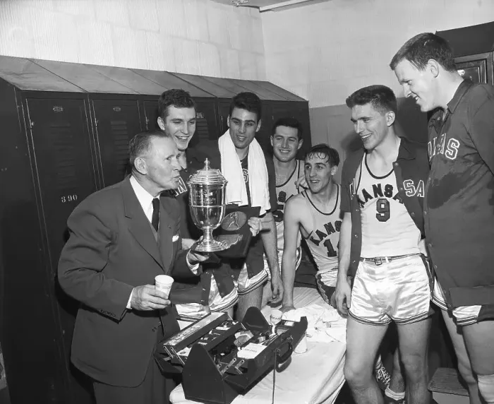 Framed Print : Coach and Kansas University Basketball Players with Trophy