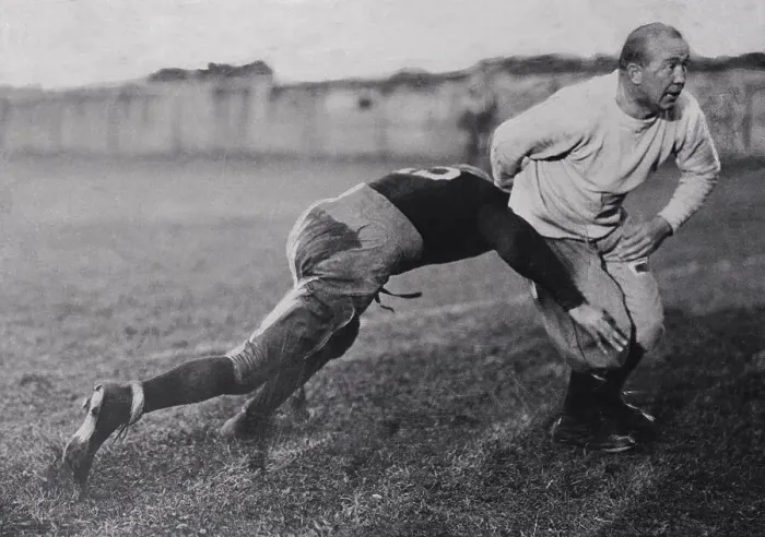 Framed Print : Coach Knute Rockne Teaching Tackling to Football Player Framed Print : Coach Knute Rockne Teaching Tackling to Football Player