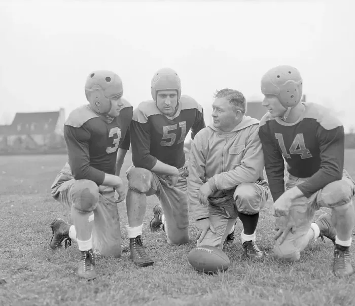 Framed Print : Coach Lambeau Meeting with Players Framed Print : Coach Lambeau Meeting with Players