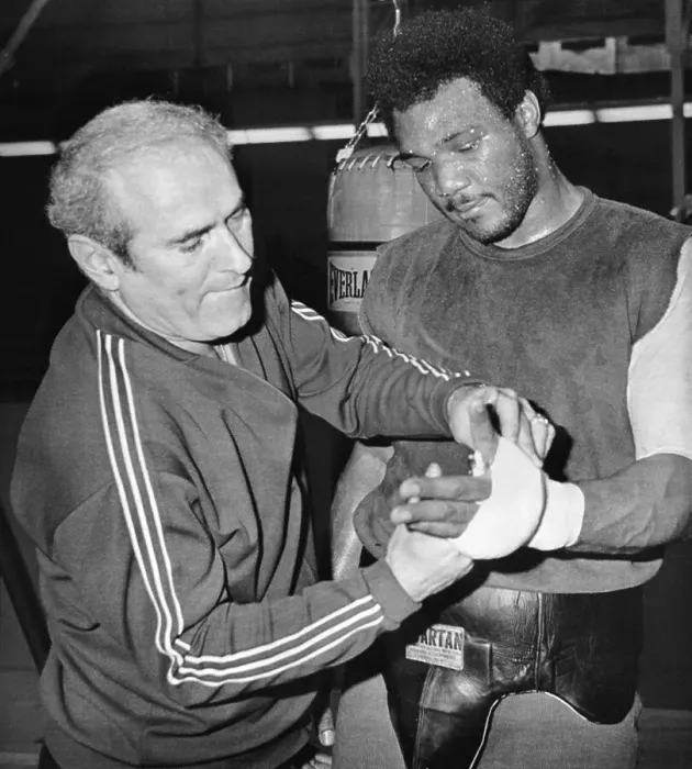 Framed Print : Coach Tapes George Foreman's Hand