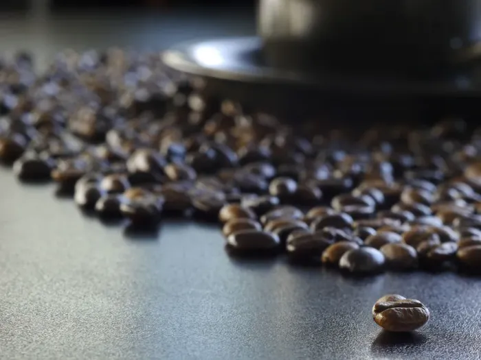 Framed Print : Coffee. A macro shot of a cup and saucer surrounded by coffee beans Framed Print : Coffee. A macro shot of a cup and saucer surrounded by coffee beans