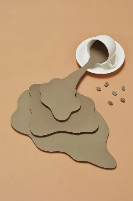 Framed Print : Coffee Spilling out from a coffee cup Framed Print : Coffee Spilling out from a coffee cup