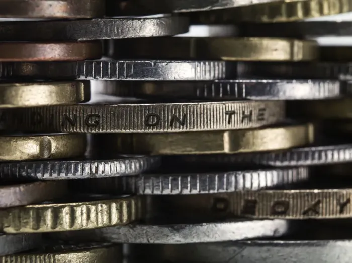 Framed Print : Coins stacked to form a wall Framed Print : Coins stacked to form a wall
