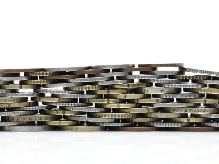 Framed Print : Coins stacked to form a wall Framed Print : Coins stacked to form a wall