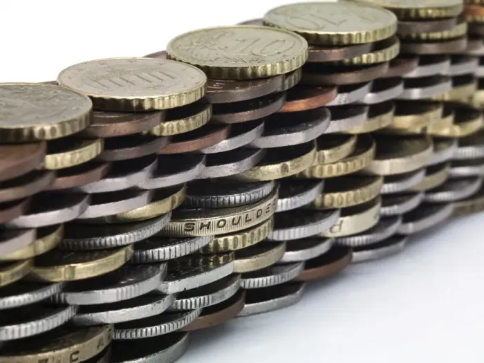 Framed Print : Coins stacked to form a wall Framed Print : Coins stacked to form a wall