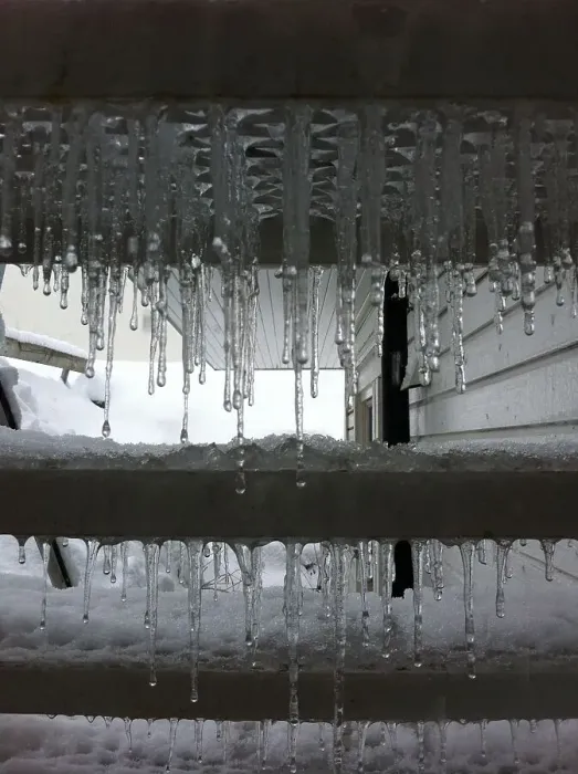 Framed Print : Cold Snap. Icicles coating the underside of stairs Framed Print : Cold Snap. Icicles coating the underside of stairs