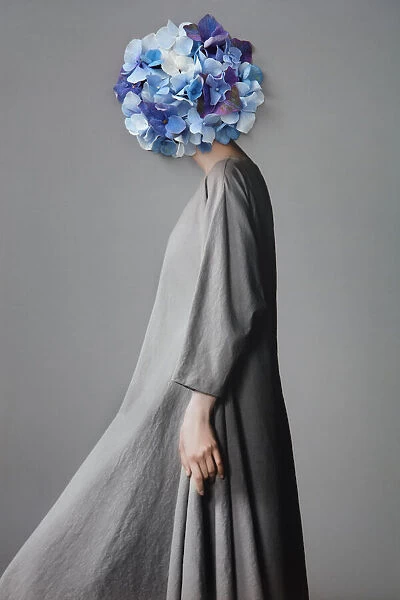 Collage with female portrait and blue flowers