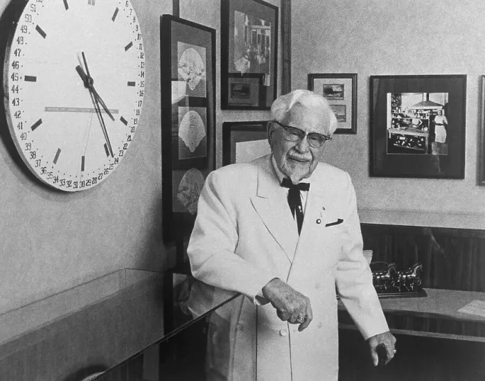 Framed Print : Colonel Harland Sanders Standing by Wall Clock