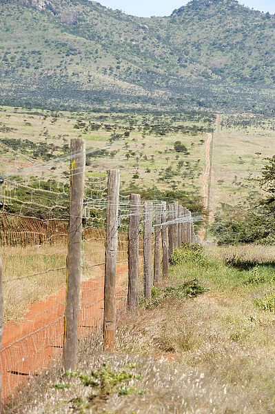 color image, colour image, day, daytime, dirt track, fence, grass, hill, kenya, laikipa district