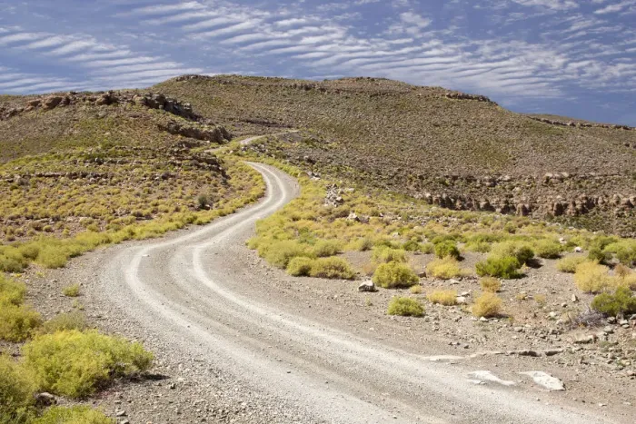 Framed Print : color image, day, daytime, dirt road, hill, horizontal, landscape, mountain road Framed Print : color image, day, daytime, dirt road, hill, horizontal, landscape, mountain road