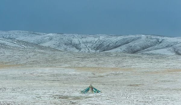 a colorful flag tent over snow field