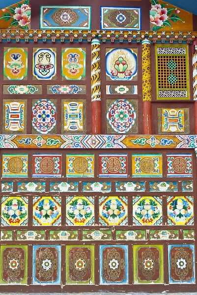 Colorful Tibetan designs on walls of temple, Jiuzhaigou National Scenic Area, Sichuan Province, China