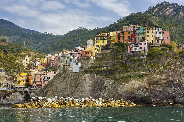 The colorful village of Manarola seen from a boat