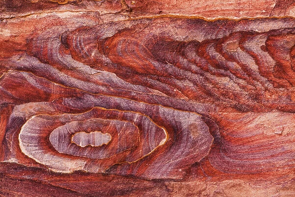 Coloured stone eroded in a design