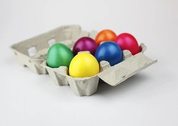 Colourful Easter eggs in an egg box