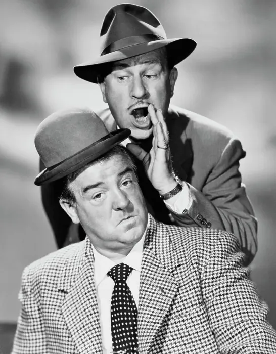 Framed Print : Comedian Bud Abbott Whispering to Lou Costello