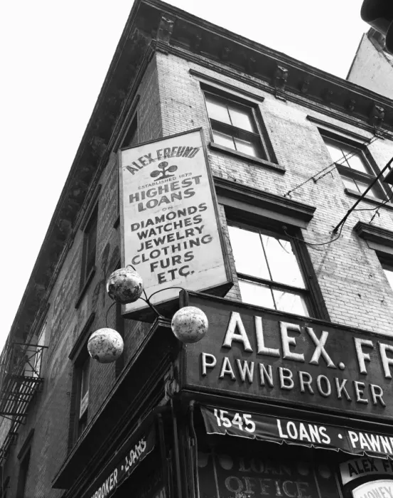 Framed Print : Comerical sign at building corner, low angle view Framed Print : Comerical sign at building corner, low angle view